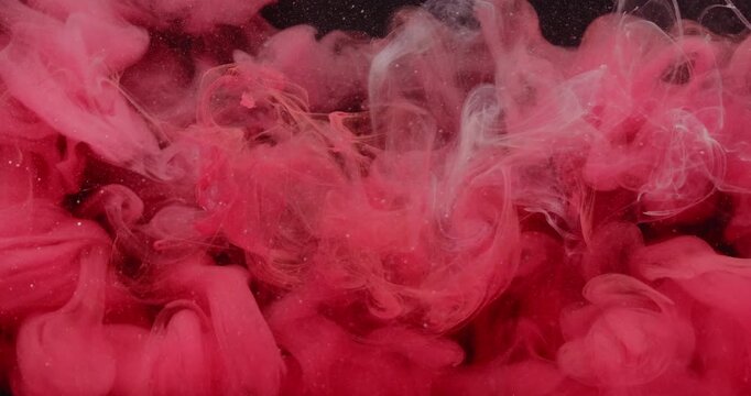 Paint vapor. Pink dye mist. Blur red color fume splash explosion smoke water droplets floating texture on abstract acrylic dark black art background.