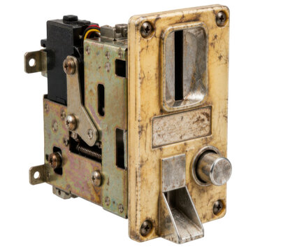 Retro aged arcade coin acceptor mechanism, metal payment mechanism with coin slot return lever and mounting frame. Studio shot isolated on white background for retro gaming design.