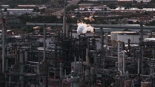 Factory going full steam industrial area drone video close up Denver Colorado 4K