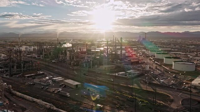 Active oil refinery smoke at sunset  industrial landscape drone video, Denver, CO 4K