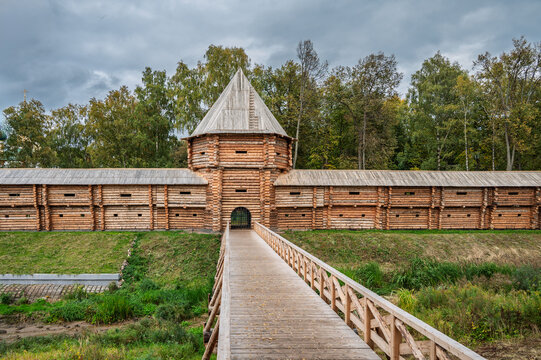 Reconstructed wooden bridge over the moat leading to the entrance of the wooden fortress of the Uglich Kremlin. Uglich, Russia.