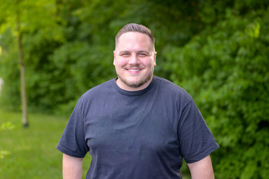 Friendly Young Man Smiling Outdoors