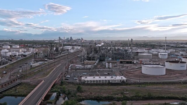 Aerial view of insutrial zone with the city skyline in the distance drone video Denver Colorado 4K
