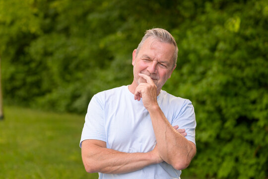 Thoughtful Senior Man Thinking Outdoors