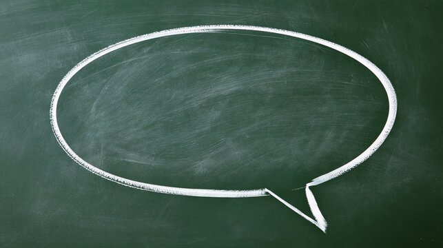 A hand-drawn speech bubble outlined in chalk on a textured green blackboard. Useful concept for education, communication, and creative messaging.