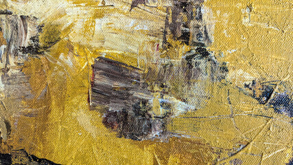 Abstract oil painting close up with thick gold and brown brushstrokes.