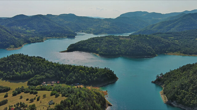 Zaovinsko Lake surrounded by forested hills and mountain in Serbia