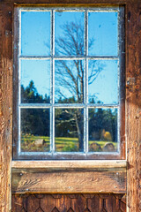 Window on an old cottage with reflections at the countryside © Lars Johansson