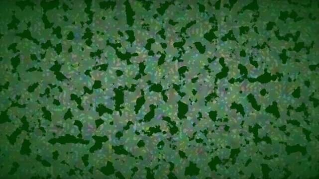 Abstract green textured background with organic camouflage pattern and dark green camouflage spots for design projects