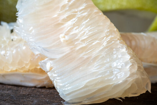 Macro view of a large single piece of juicy pomelo pulp