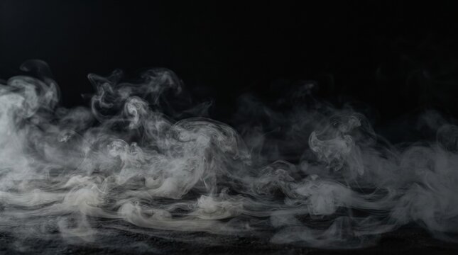Dramatic billowing white smoke against a stark black background creating a moody and mysterious atmospheric effect