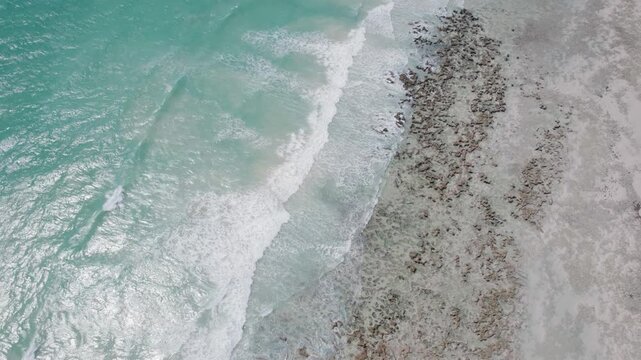 Turquoise Ocean Waves Meeting Sandy Beach Near Broome