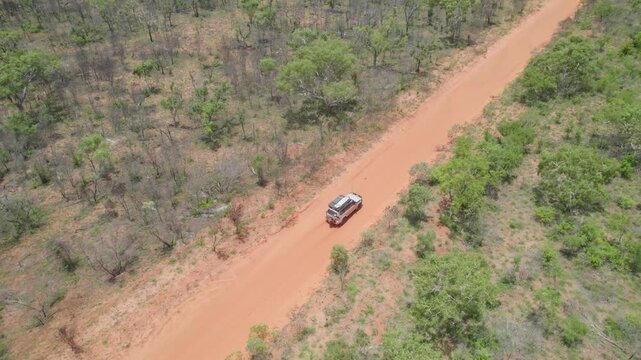4WD Driving on Red Dirt Track Through Sparse Bushland Outback
