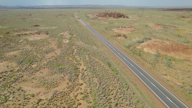 Road Train Driving on Straight Highway Through Australian Outback