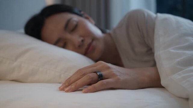 Woman Sleeping with Smart Health Ring for Biometric Sleep Tracking and Wellness Monitoring