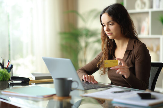 Young telecommuter working and buying online