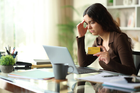 Worried young telecommuter having problem paying online
