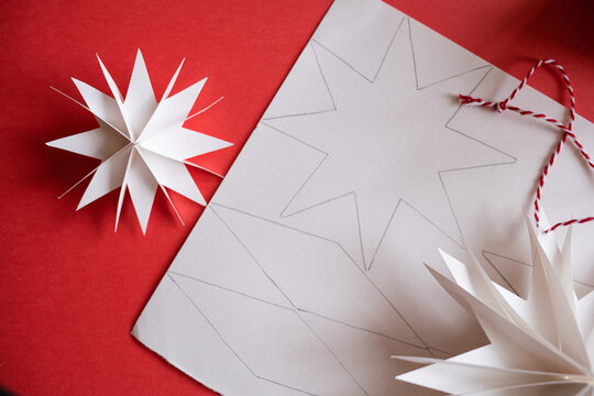 DIY gift handmade Christmas tree decorations: toy snowflakes star. paper craft for kids. create art for children.