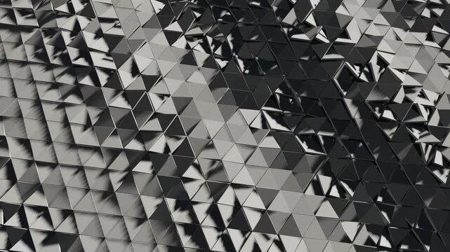 Abstract geometric triangle background with moving metallic polygons 4K loop