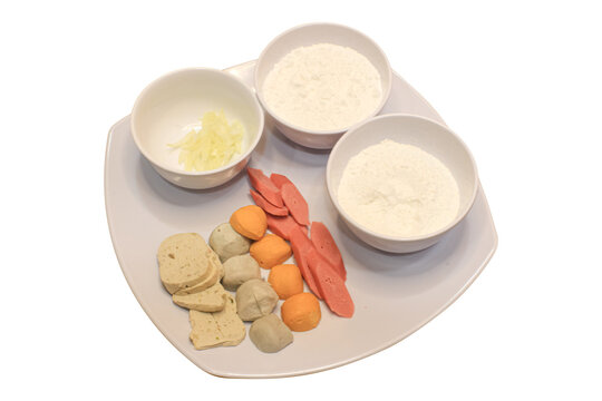Cooking ingredients with flour and sliced sausages isolated on plain background