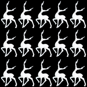 Christmas white reindeer frosted decoration seamless diagonal pattern on black. Xmas symbol for greeting card or wrapping paper. 