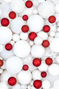 Red white red Christmas sparkling tree decorations with sphere shape balls background. Festive symbols for the holiday season greeting card.