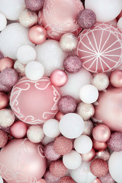 Pink and white Christmas tree decorations festive background. Glittering design for Xmas holiday season for greeting card.
