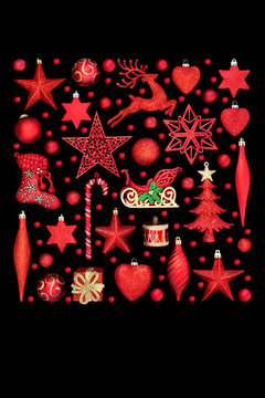 Fun red Christmas tree decorations and festive ornaments on black with holly berries. Collection of festive symbols for the holiday season, greeting card.