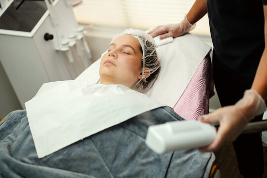 Young woman relaxes during cosmetic skin treatment