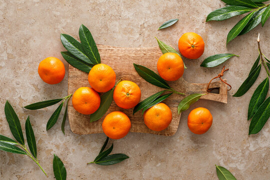 Mandarins fresh citrus fruit with green leaves