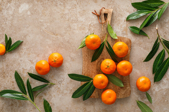 Mandarins fresh citrus fruit with green leaves