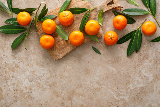 Mandarins fresh citrus fruit with green leaves