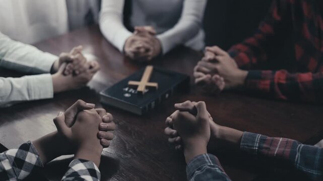 Group of Friends Praying and Reading Bible in Church Fellowship