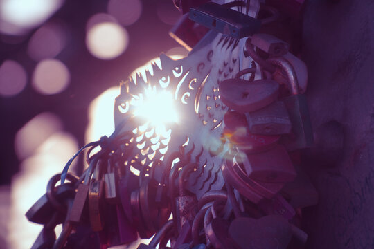 Ornate Metal Decoration and Love Locks in Purple Back light.