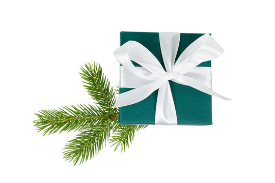 dark green christmas gift box with white ribbon and fir tree branch isolated on white or transparent png