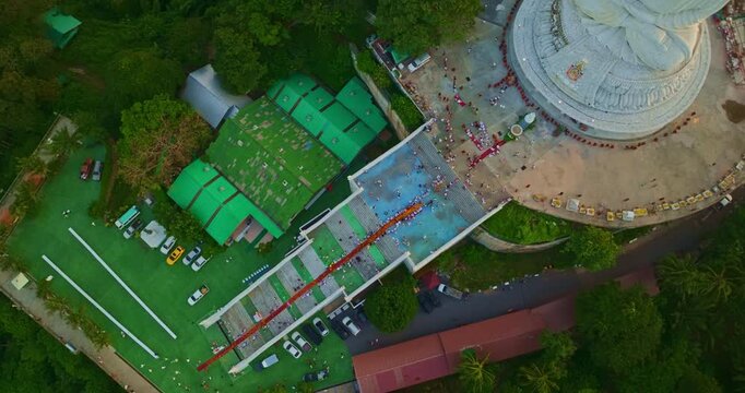 Aerial view of Local residents warmly welcome 150 forest monks during a sacred Dhutanga journey at Phuket Big Buddha Temple, preserving Thailand's rich Buddhist traditions and spiritual heritage.
