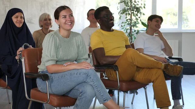 Portrait of students of different years and of different nationalities on training session in lecture hall 
