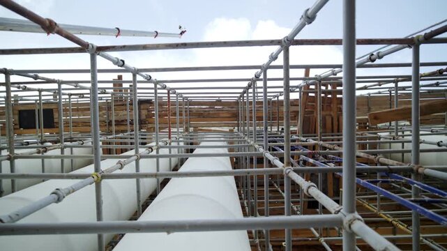 Scaffolding provides essential support for workers. Stable temporary structure gives construction workers reliable access to upper levels