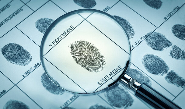 Magnifier and fingerprint police form.  Background on the theme of crime, police, fbi, detective, investigation, consequent; inquiry; inquest. Also the topic of security, identification etc.