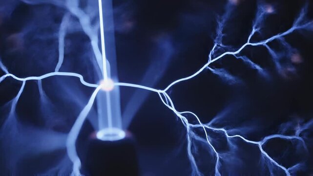 Electric plasma arcs forming intricate branching patterns in dark blue light with subtle motion