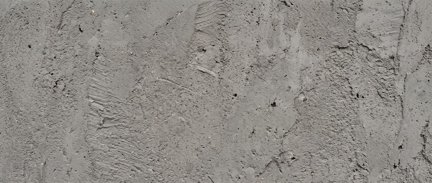 Gray cement grout texture background. Rough concrete plaster surface with trowel marks and masonry details