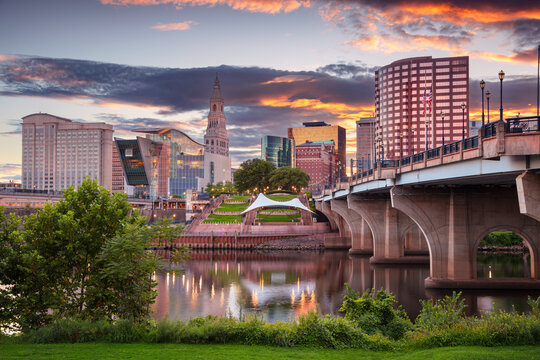 Hartford, Connecticut, USA. Cityscape image of Hartford, capital city of Connecticut with reflection of the city skyline in the water at beautiful sunset.