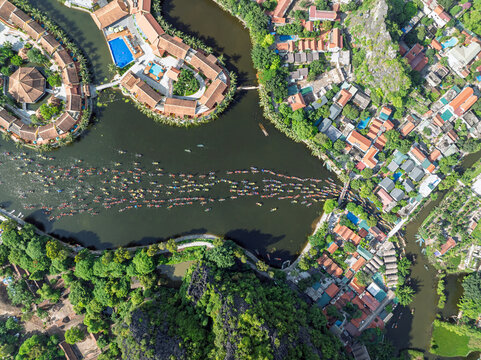 Boat procession through Tam Coc during the Tam Coc festival in Ninh Binh, Vietnam