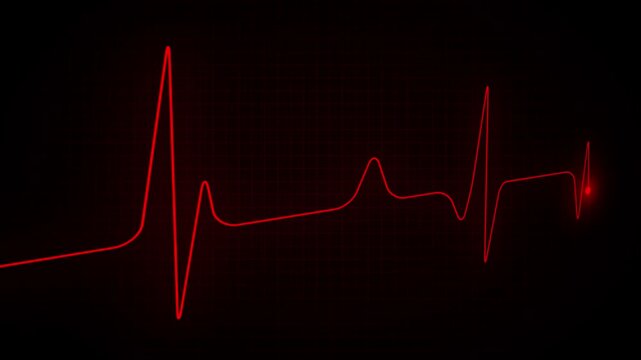 Glowing red heart monitor waveform on a dark black background, showing a pulse rhythm line with dramatic medical and emergency concept.