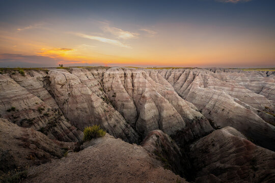 Badlands Canyon Landscape Under Dramatic Cloudy Sky in Badlands NP, South Dakota
