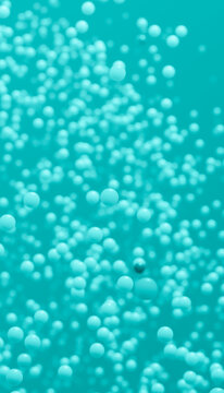 Floating blue spheres forming an abstract pattern on turquoise