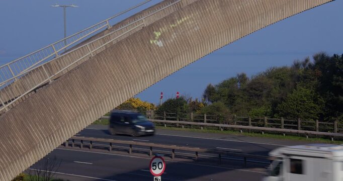 Zoom shot of the rainbow bridge and A55. Taken from the south side of the road