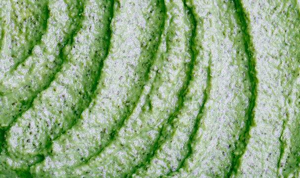 Green smoothie with celery, spinach, kiwi, cucumber and other vegetables and fruits. Healthy yogurt. Sorbet texture. Delicious diet food close-up as a background.