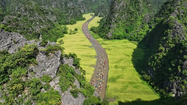 Tam Coc festival boats through rice valley during the Tam Coc festival in Ninh Binh, Vietnam