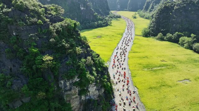 Tam Coc festival flotilla in karst valley during the Tam Coc festival in Ninh Binh, Vietnam